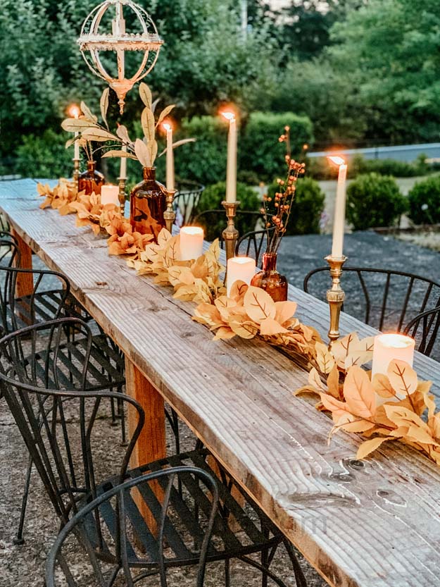 Outdoor Fall Tablescape with Leaves |fall table settings|farmhouse table|fall farmhouse table|farmhouse decor|fall leaves|fall leaf diy|outdoor tablescape|fall table settings|amber jars|fall centerpiece|amber fall decor|fall diy|fall craft|Hallstrom Home