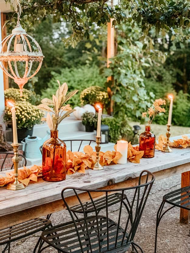 Outdoor Fall Tablescape with Leaves |fall table settings|farmhouse table|fall farmhouse table|farmhouse decor|fall leaves|fall leaf diy|outdoor tablescape|fall table settings|amber jars|fall centerpiece|amber fall decor|fall diy|fall craft|Hallstrom Home