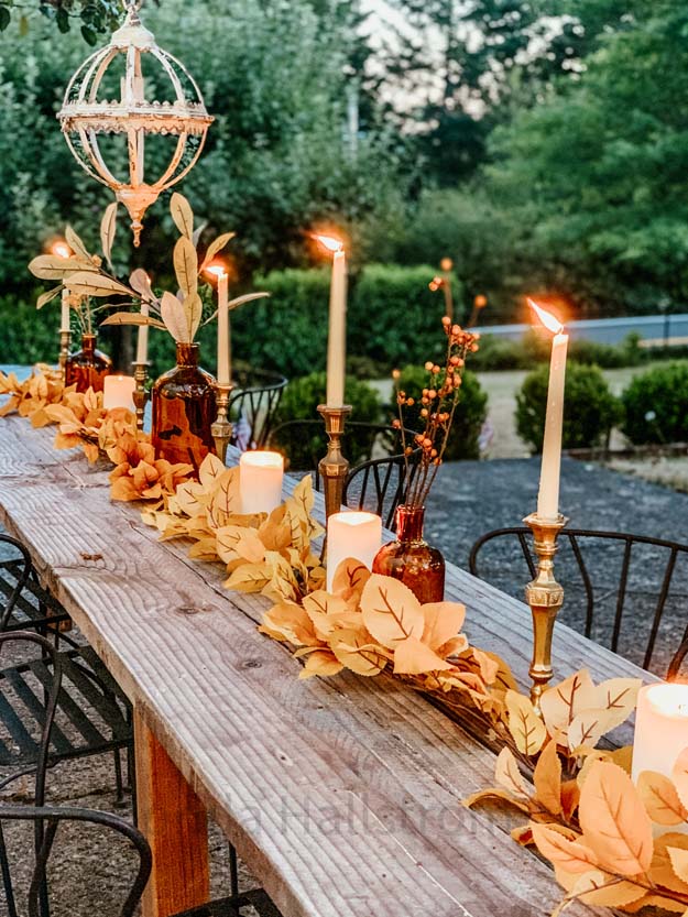 Outdoor Fall Tablescape with Leaves |fall table settings|farmhouse table|fall farmhouse table|farmhouse decor|fall leaves|fall leaf diy|outdoor tablescape|fall table settings|amber jars|fall centerpiece|amber fall decor|fall diy|fall craft|Hallstrom Home