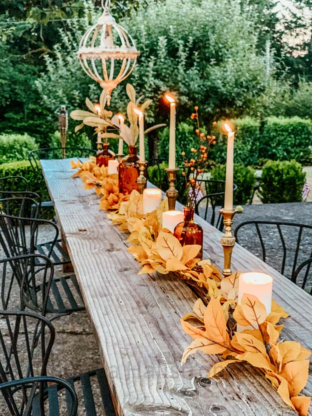 Outdoor Fall Tablescape with Leaves |fall table settings|farmhouse table|fall farmhouse table|farmhouse decor|fall leaves|fall leaf diy|outdoor tablescape|fall table settings|amber jars|fall centerpiece|amber fall decor|fall diy|fall craft|Hallstrom Home