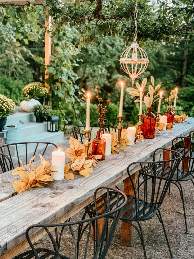 Outdoor Fall Tablescape with Leaves |fall table settings|farmhouse table|fall farmhouse table|farmhouse decor|fall leaves|fall leaf diy|outdoor tablescape|fall table settings|amber jars|fall centerpiece|amber fall decor|fall diy|fall craft|Hallstrom Home