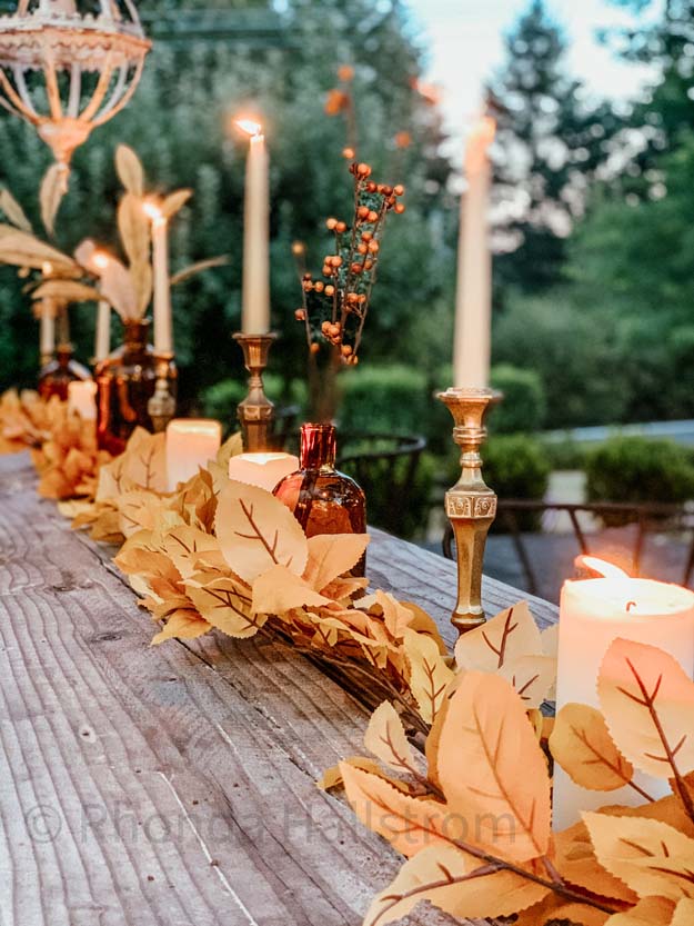 Outdoor Fall Tablescape with Leaves |fall table settings|farmhouse table|fall farmhouse table|farmhouse decor|fall leaves|fall leaf diy|outdoor tablescape|fall table settings|amber jars|fall centerpiece|amber fall decor|fall diy|fall craft|Hallstrom Home