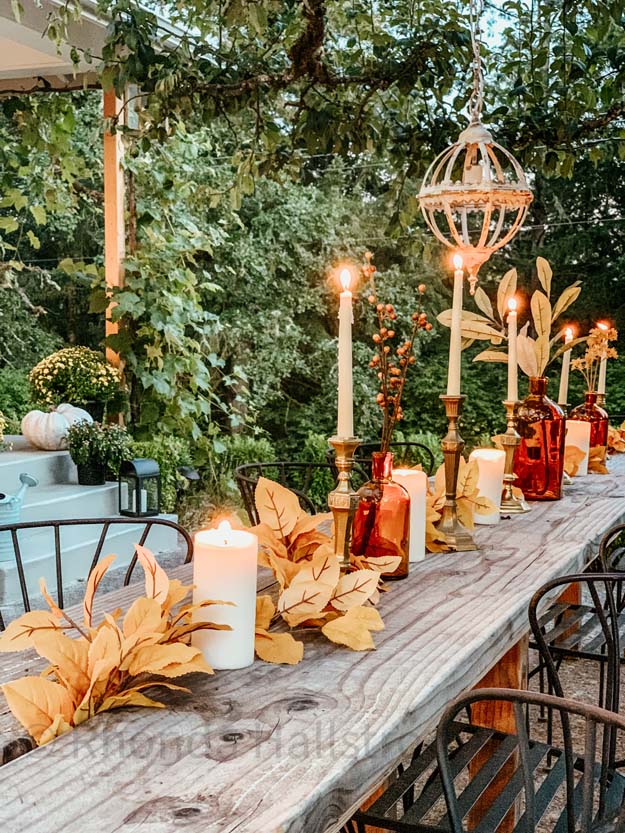 Outdoor Fall Tablescape with Leaves |fall table settings|farmhouse table|fall farmhouse table|farmhouse decor|fall leaves|fall leaf diy|outdoor tablescape|fall table settings|amber jars|fall centerpiece|amber fall decor|fall diy|fall craft|Hallstrom Home