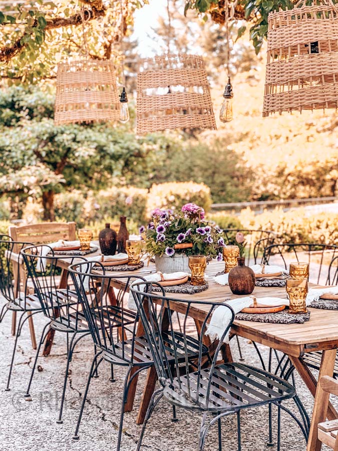 How To Hang String Lights Outdoor / How to hang lights on patio / how to hang lights outside / basket lights / best summer lighting / how to hang basket lights / diy hanging lights / boho lights / farmhouse lighting / light hanging tutorial / easy outdoor lighting / outdoor tablescape / family dinner / summer tablescapes / HallstromHome