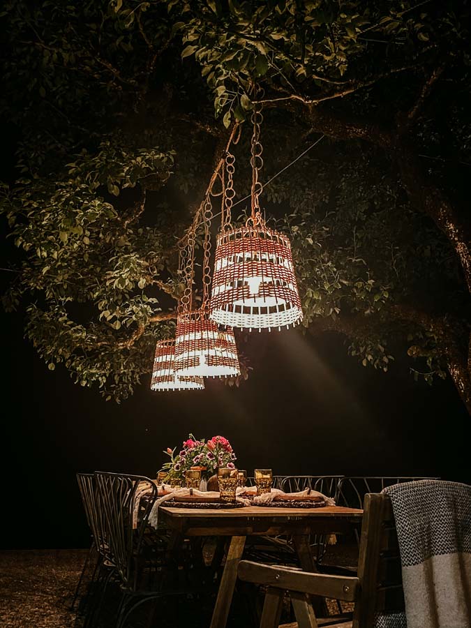 How To Hang String Lights Outdoor / How to hang lights on patio / how to hang lights outside / basket lights / best summer lighting / how to hang basket lights / diy hanging lights / boho lights / farmhouse lighting / light hanging tutorial / easy outdoor lighting / outdoor tablescape / family dinner / summer tablescapes / HallstromHome